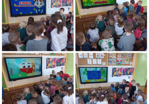 Na zdjęciu dzieci oglądają flagę Unii Europejskiej, kontury mapy Polski i Ukrainy oraz ich barwy narodowe.